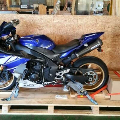 Yamaha R1 sportbike inside a wooden crate, side view