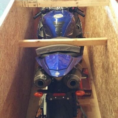 Yamaha R1 sportbike inside a wooden crate, rear view