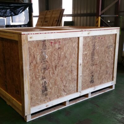 Closed wooden crate with markings and security tape