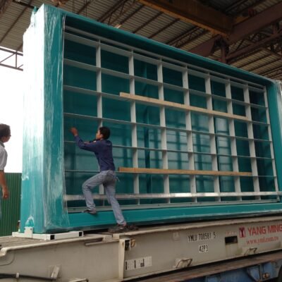 Custom steel container frame being loaded onto a trailer