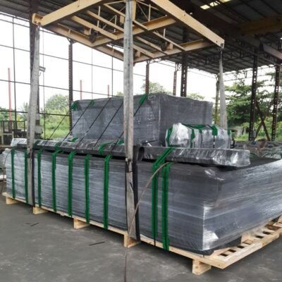 Stack of steel sheets strapped on wooden pallets