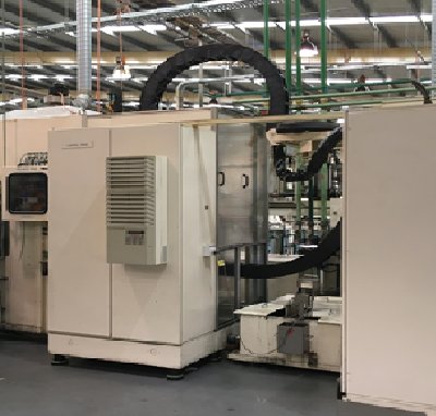 Industrial equipment unit with piping in a warehouse