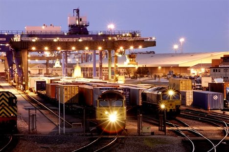 Rail yard with freight trains at night